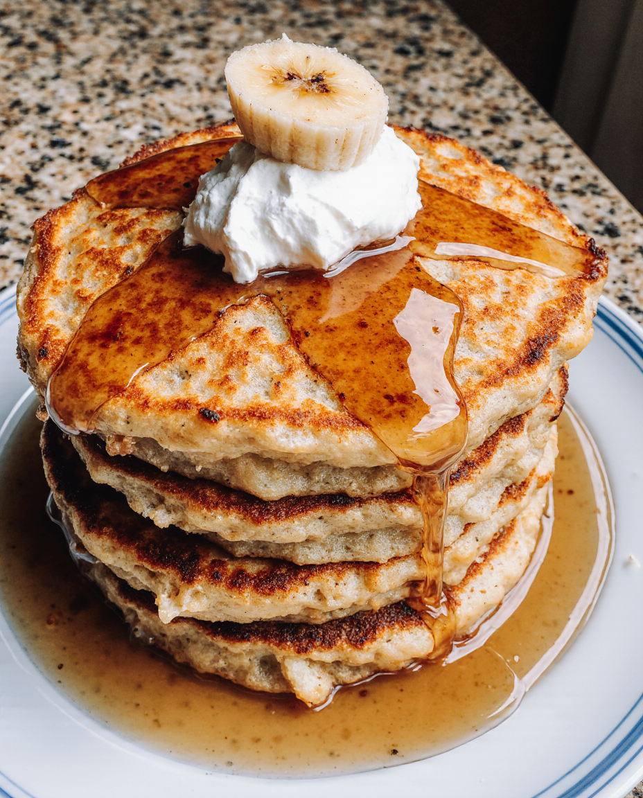 Najlepszy przepis na puszyste naleśniki bananowe z twarogiem | Closeup zoomed-in amateur photo from reddit, taken with iphone 17 pro MAX in human view side angle, looking taken by amateur, juicy mouthwatering homemade fluffy banana pancakes with cottage cheese, golden brown and perfectly cooked, served with a drizzle of maple syrup and fresh fruits on the side. --iw 3