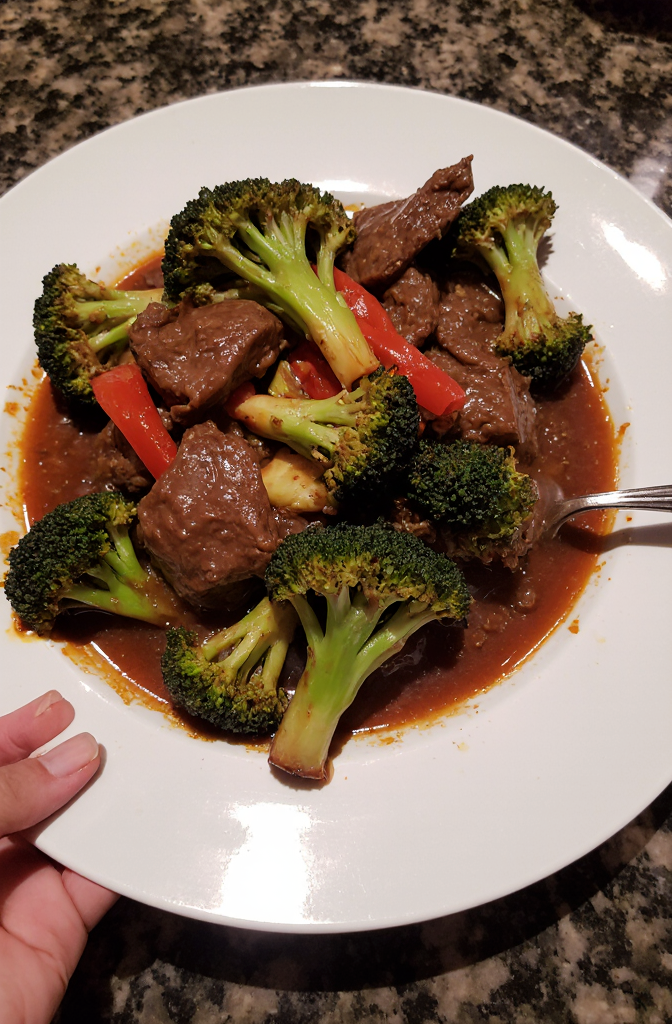 Wołowina po chińsku z brokułami | Closeup zoomed-in amateur photo from reddit, taken with iphone 15 pro in human view side angle, looking taken by amateur, juicy mouthwatering homemade Chinese beef with broccoli, featuring tender slices of beef stir-fried to perfection, vibrant green broccoli florets, and colorful red bell peppers, all coated in a rich, savory sauce that glistens invitingly. --iw 3